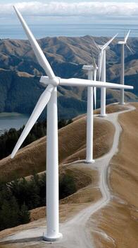 A group of wind turbines on a hillside photo