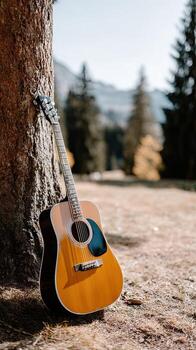 Guitar by the tree photo