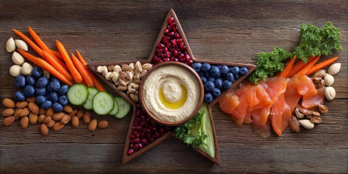 Hummus and appetizers arranged in star shape for festive food presentation photo
