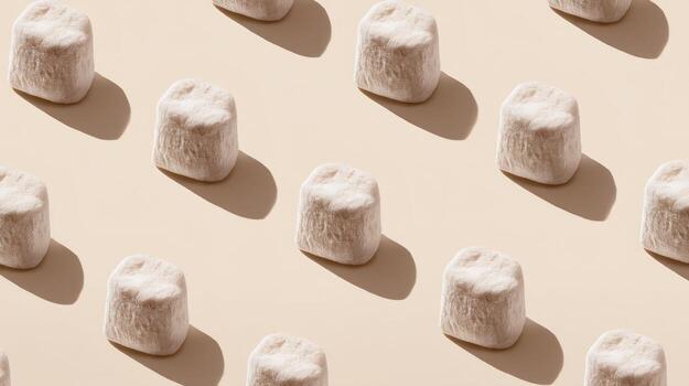 Overhead view of multiple white objects on a light background with shadows photo