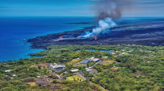 Aerial view of volcanic eruption with smoke and lava flow near ocean photo