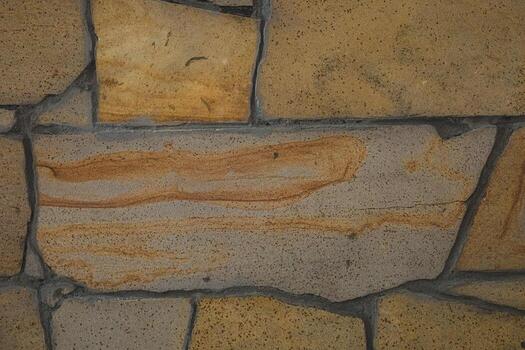 natural Roca pared con único patrones y texturas en calentar colores creando un rústico Mira foto