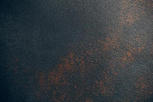 Unique textured surface showcasing dark hues with rust like spots and patterns photo