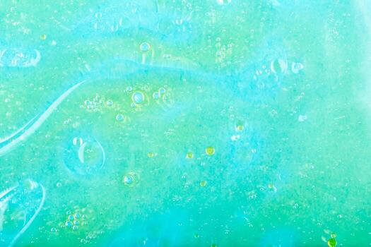Water background with oil stains. Abstract turquoise background featuring bubbles and fluid textures, creating vibrant and dynamic visual effect, ideal for various creative design projects photo