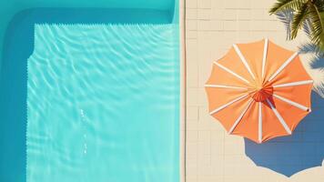 Seamless Loop of Sunny Poolside with Orange Umbrella, Top View with Copy Space. video