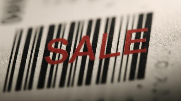 Close up of a barcode with the word sale in red bold letters photo