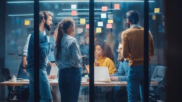 Diverse group of colleagues collaborating in a modern office environment photo