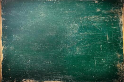 Surface of a green chalkboard displaying a textured, worn appearance, ideal for writing or drawing in classrooms and creative environments photo