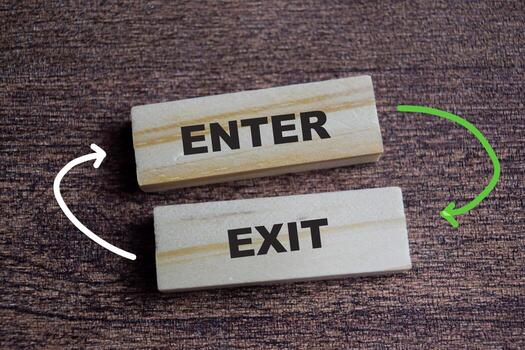 Enter and exit on stacked wooden cubes on the table. Symbolizing access and planning. Business and finance concept photo