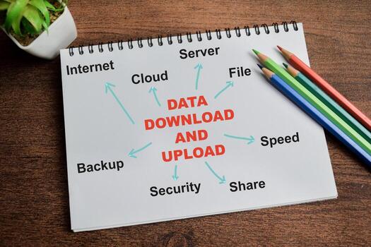 Concept of Data download and Upload write on book with keywords isolated on Wooden Table. photo