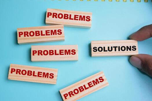 Solutions or problems on stacked wooden cubes on the table. Business and finance concept photo