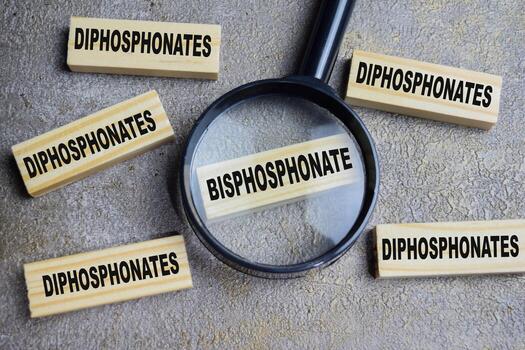 Bisphosphonate or diphosphonates on stacked wooden cubes on the table. Business and finance concept photo