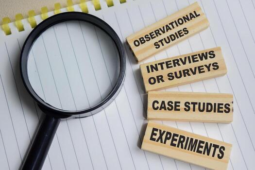 Concept of 4 major methods of psychological research. Observational studies, interviews or surveys, case studies and experiment on stacked wooden cubes on the table. Business and finance concept photo