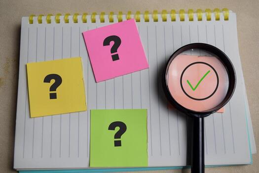 Concept of right or true and question mark symbolizing investigation, validation or seeking truth write on sticky notes isolated on Wooden Table. photo