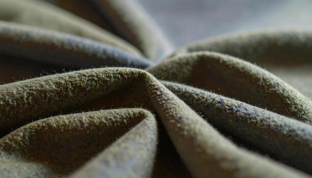 Close-up of Textured Olive Green Fabric with Visible Fibers and Folds, Abstract Textile Pattern. photo