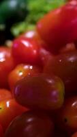 tomatoes cucumbers in a basket harvest Animation of a group of tomato. Many tomatoes slowly rotate in the background in space. Horizontal composition. Defocus. Close-up. video