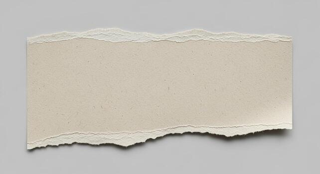 A torn piece of beige textured paper isolated on white background photo