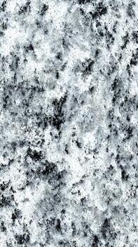 Intricate patterns of contrasting mineral aggregates forming a monochrome abstract surface photo