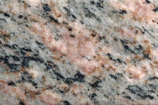 Intricate Patterns and Hues in Polished Stone Slab with a Textured Surface photo