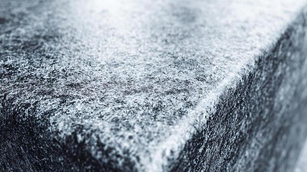 Intricate Silver Granite Surface with a Subtle Texture in Sharp Detail for Background photo