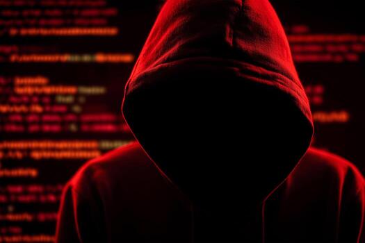 A person wearing a hoodie in front of a binary code photo