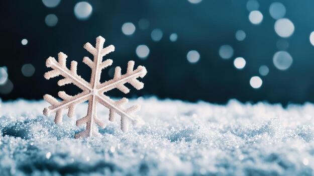 a snowflake is sitting on the snow covered ground photo