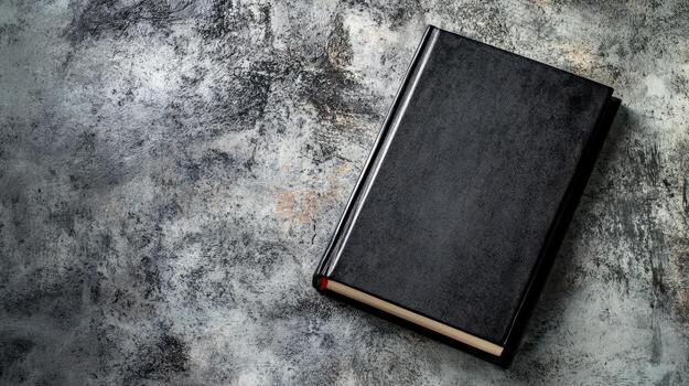 a black book on a grungy background photo