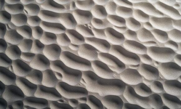 A close up of a sand texture with many different patterns photo