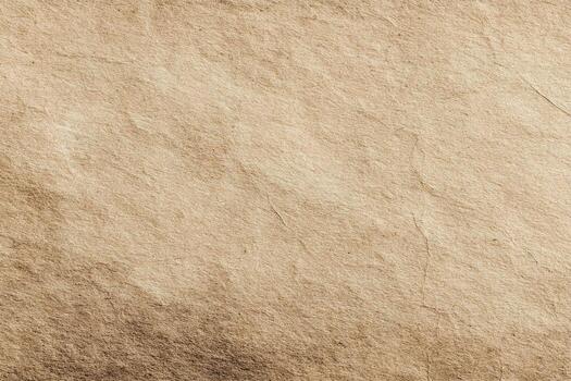 Beige textured paper background with some darker brown patches at the corners and creases or cracks. Vintage paper background, old paper photo