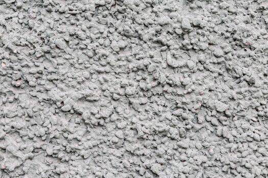 Textured grey wall surface with abstract patterns and uneven design photo