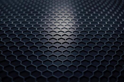 Dark hexagonal grid pattern with subtle lighting and depth of field photo
