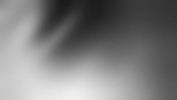 A smooth, abstract grayscale image featuring soft gradients and blurred shapes, creating a tranquil and minimalist aesthetic.dark abstract background vector