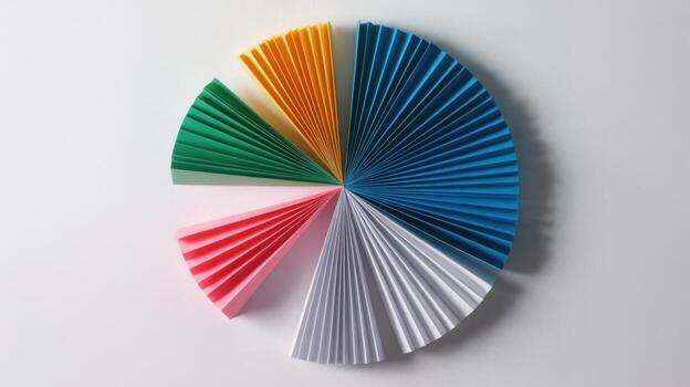Colorful paper pie chart with different sections isolated on white background photo
