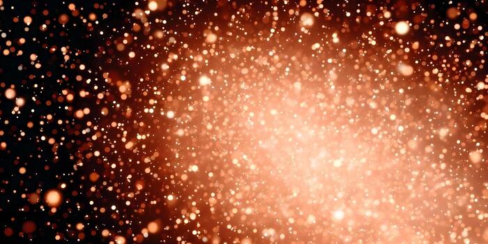 A shimmering abstract background features golden bokeh light particles falling gracefully on a dark backdrop photo