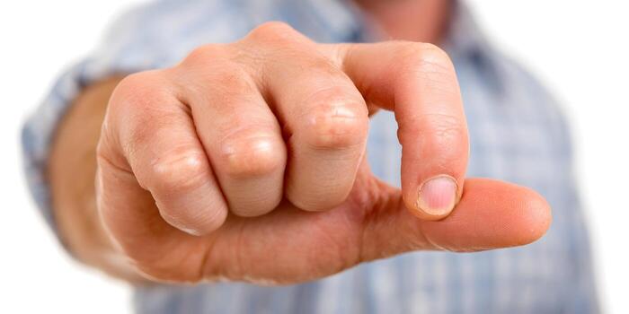 A hand gestures indicating a tiny amount or size with the thumb and index finger photo
