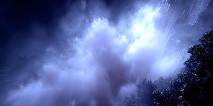 Deep blue and purple clouds and fog drift through a mystical forest and rugged mountain landscape photo