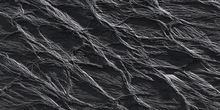 Dark textured background with tangled gray fibers creating an abstract pattern photo
