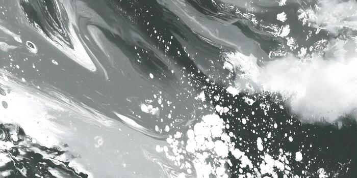 Abstract fluid art pattern with swirling black white and grey paint creating a dynamic texture photo