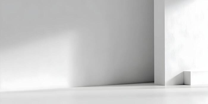 A bright white minimalist empty room corner with abstract shadows creating a modern studio background photo