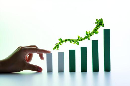 Hand pushing wooden blocks in a growing chart with a green arrow photo