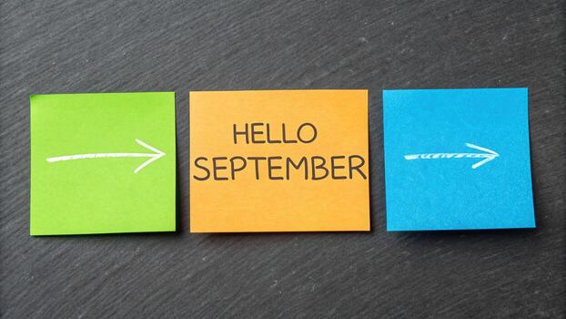 Hello september message on colorful sticky notes photo