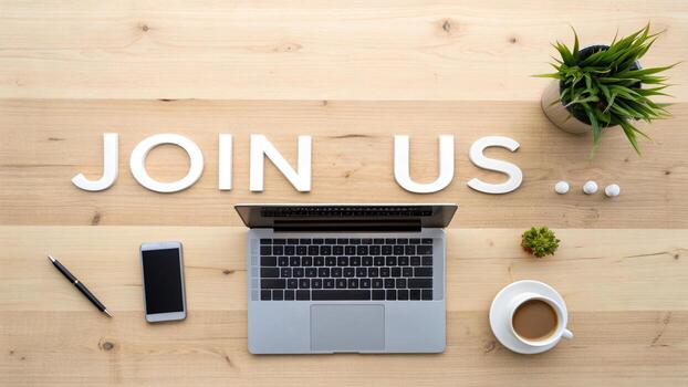 Laptop and join us text on wooden background photo