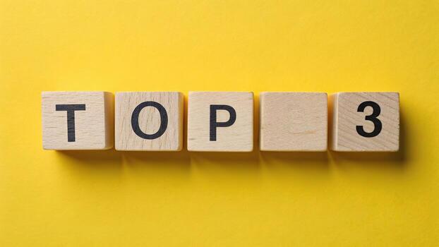 Top 3 text on wooden blocks on yellow surface photo