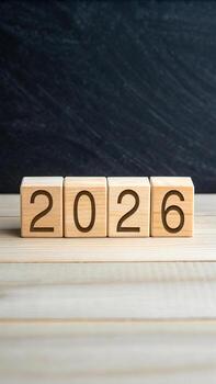 de madera bloques con el año 2026 en de madera mesa foto