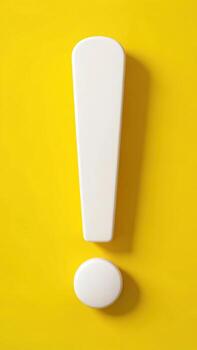 White exclamation mark on yellow background studio photo