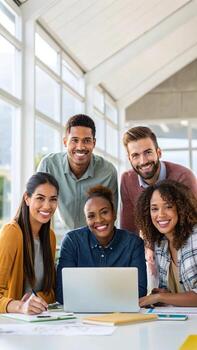 Happy diverse team working on laptop in office photo