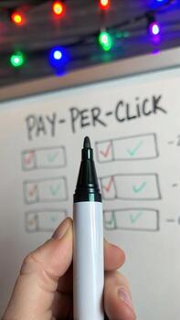 Pay per click marketing strategy on whiteboard photo
