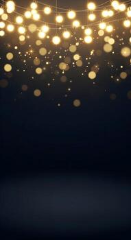 Golden string lights with bokeh effect against a dark background photo