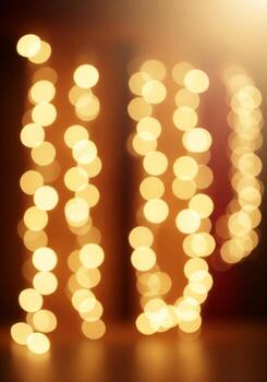 Abstract Yellow String Lights Bokeh Effect in Vertical Hanging Position Background photo