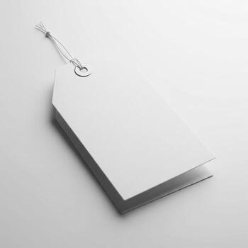 Blank Rectangular White Price Tag with String on a Soft Gray Background photo